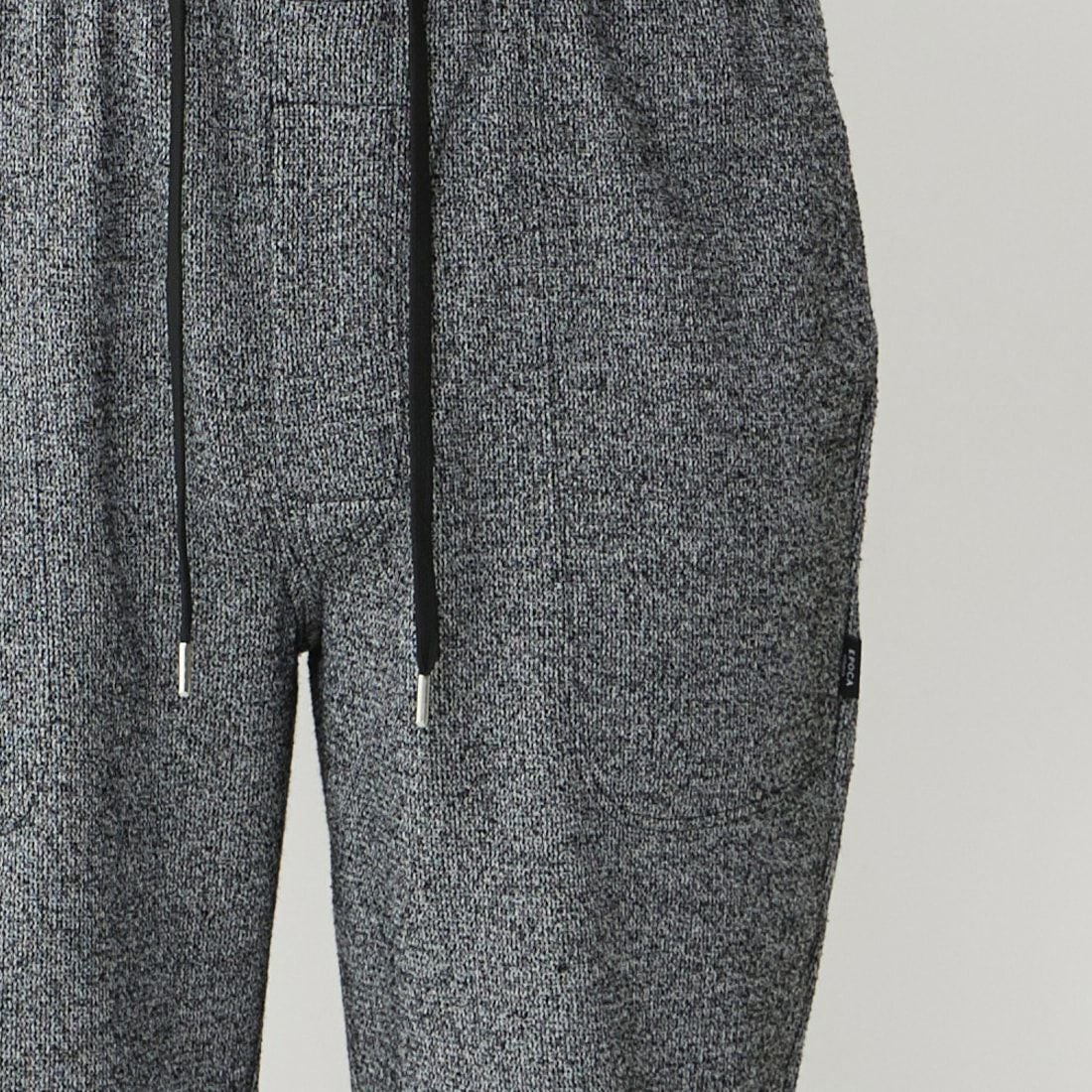 エポカ ウォモ 前開きロングリブテーパードパンツ